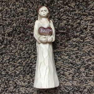 “Faith” angel statue